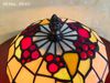 Đèn tiffany ốp tường bằng kính với khung được làm bằng kim loại