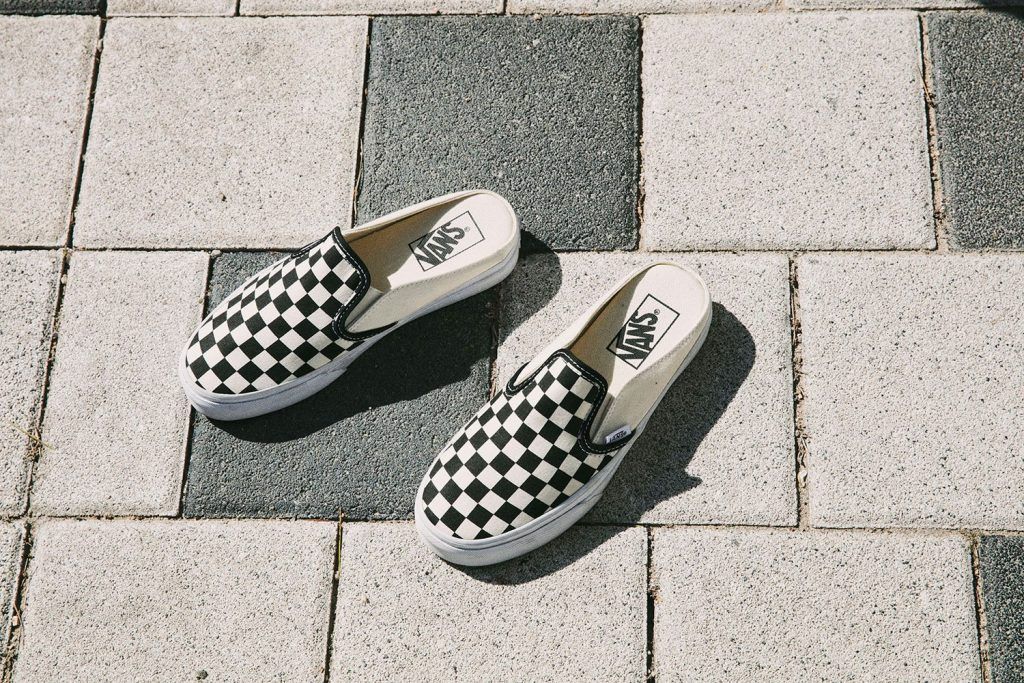 vans checkerboard mule slip on