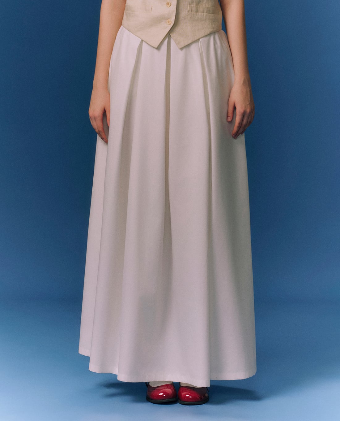 GIGI - Chân váy xếp li midi lưng thun thanh lịch