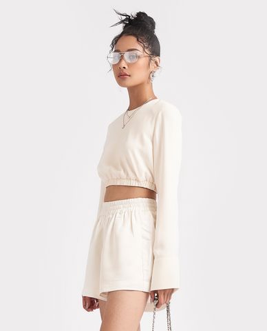  GIGI - Áo croptop nữ tay dài bo thun hiện đại 