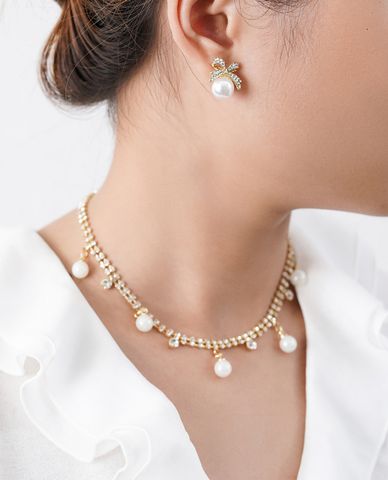  CECI - Khuyên tai nữ hình chiếc nơ đính đá phối ngọc trai sang trọng 