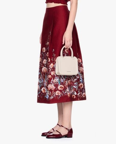  GIGI - Chân váy chữ A midi phối họa tiết hoa thời trang 