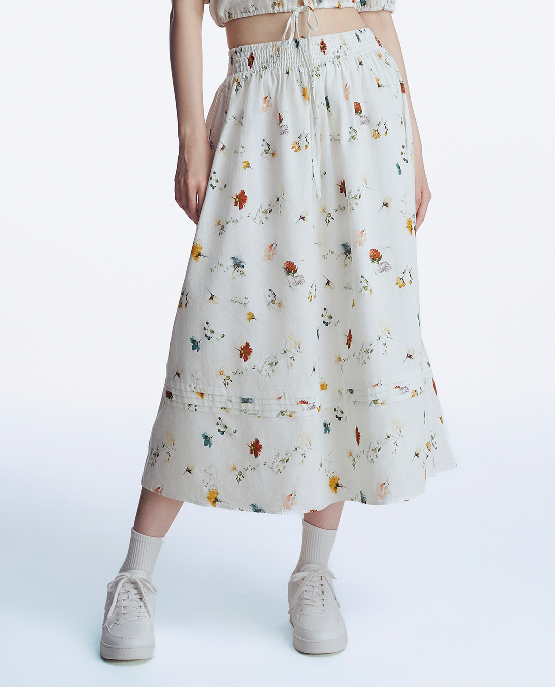 GIGI - Chân váy midi lưng thun phối hoạ tiết hoa trẻ trung