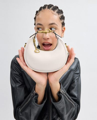  COACH - Túi xách nữ phom bán nguyệt phối mắc xích Jonie 