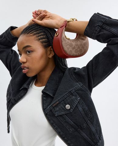  COACH - Túi xách nữ phom bán nguyệt phối hoạ tiết monogram Jonie 