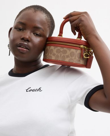  COACH - Túi xách tay nữ hình trụ tròn Signature Canvas 