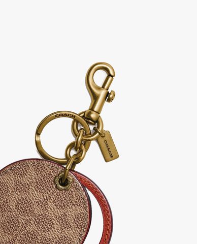  COACH - Móc khóa túi nữ phom tròn phối gương 