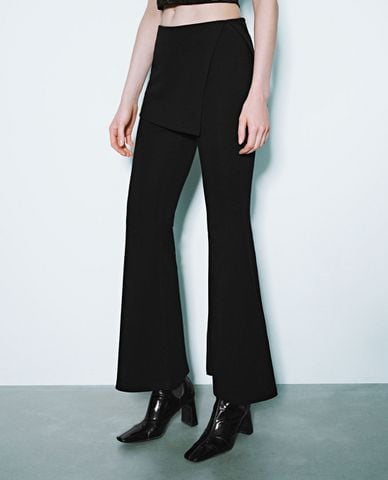  URBAN REVIVO - Quần nữ ống loe phối chân váy mini cá tính 