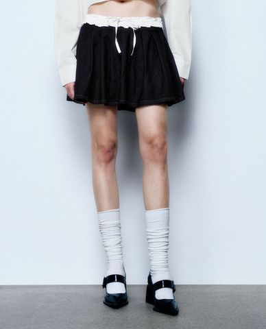  URBAN REVIVO - Chân váy denim mini phối nơ thời trang 