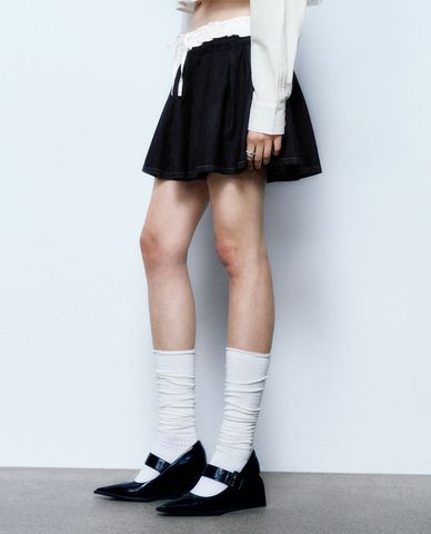  URBAN REVIVO - Chân váy denim mini phối nơ thời trang 