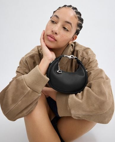  COACH - Túi xách nữ phom bán nguyệt phối mắc xích Jonie 