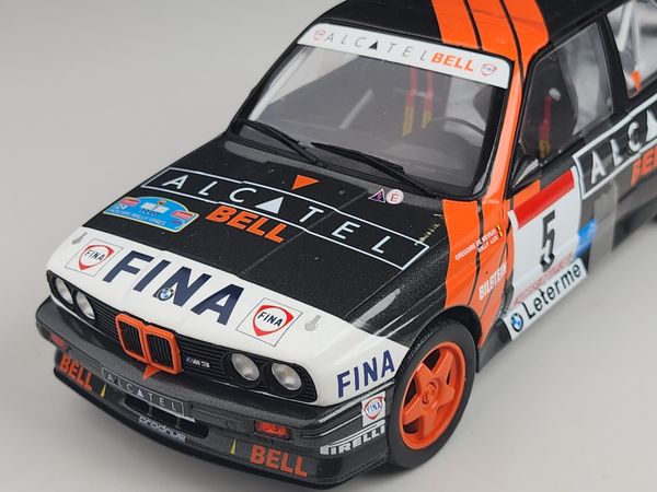 Xe mô hình BMW E30 M3 Group a - Rallye Ypres 1990 1:18 Solido (Đen sọc cam)