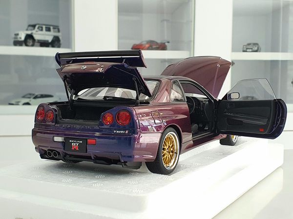 Xe Mô Hình Nissan Skyline GT-R ( R34 ) V-SPEC II 1:18 AUTOart ( Tím Biến Màu )