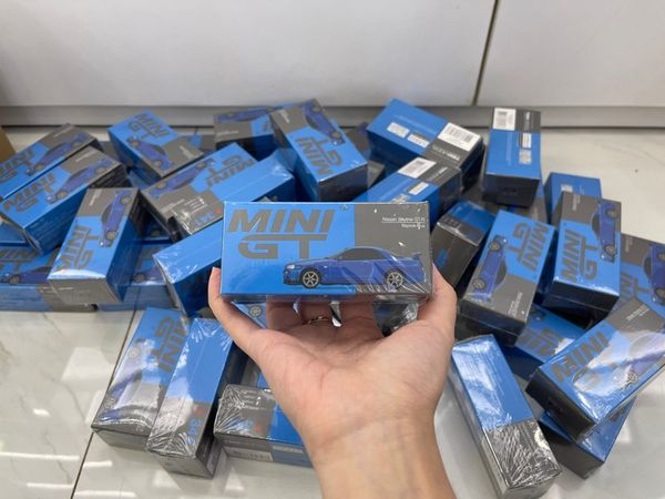 Xe Mô Hình Nissan Skyline GT-R (R34) V-Spec II Bayside Blue 1:64 MiniGT ( Xanh )