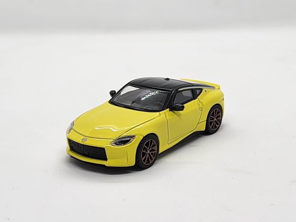 Xe Mô Hình Nissan Z Proto Spec 2023 Ikazuchi Yellow LHD 1:64 Minigt ( Vàng )