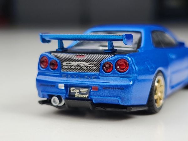 Xe Mô Hình Nissan Skyline GT-R (R34) Top Secret Bayside Blue RHD 1:64 MiNiGT ( Xanh )