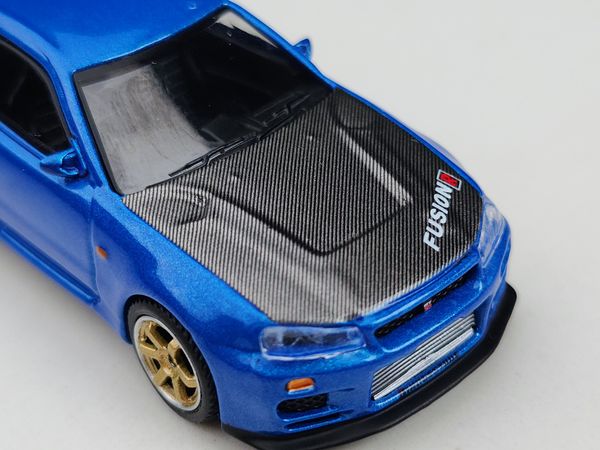 Xe Mô Hình Nissan Skyline GT-R (R34) Top Secret Bayside Blue RHD 1:64 MiNiGT ( Xanh )