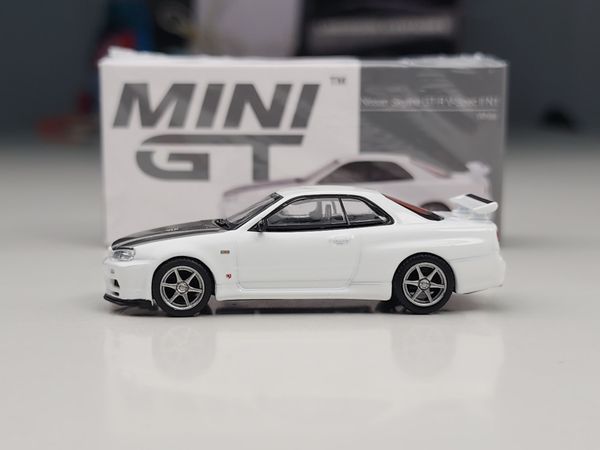 Xe Mô Hình Nissan Skyline GT-R (R34) V- Spec II N1 1:64 MINIGT ( White )