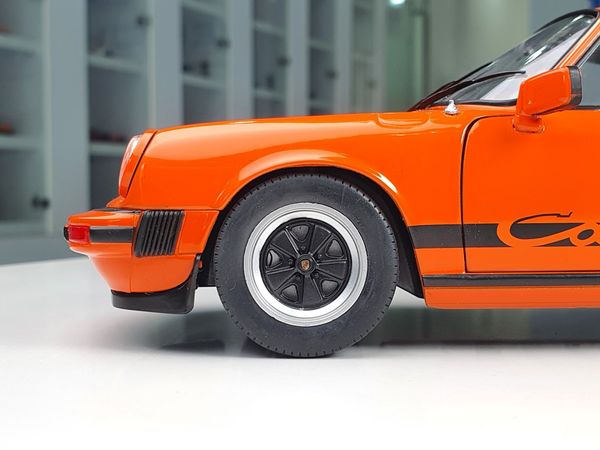 Xe mô hình Porsche 911 3.0 Carrera Orange 1977 1:18 Solido (Cam)