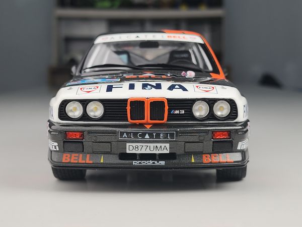 Xe mô hình BMW E30 M3 Group a - Rallye Ypres 1990 1:18 Solido (Đen sọc cam)