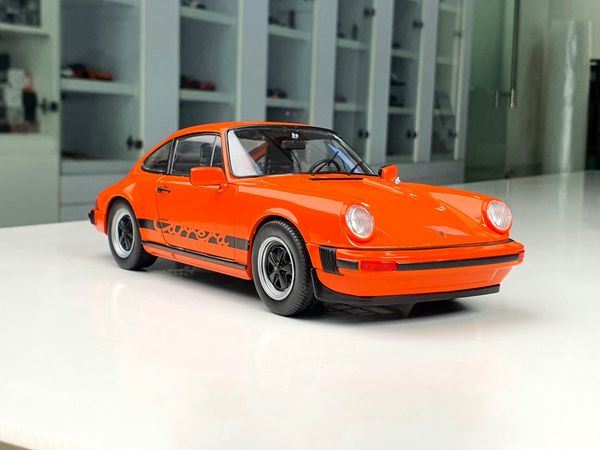 Xe mô hình Porsche 911 3.0 Carrera Orange 1977 1:18 Solido (Cam)