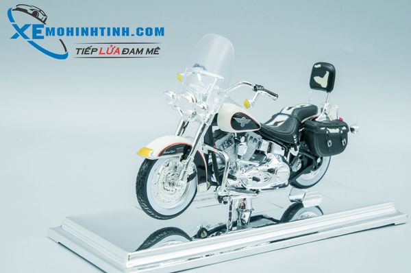 XE MÔ HÌNH HARLEY DAVIDSON 1993 FLSTN Heritage Softail 1:18 MAISTO (TRẮNG ĐEN)