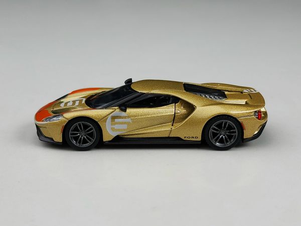 Xe Mô Hình Ford GT Holman Moody Heritage Edition LHD 1:64 MiNiGT ( Vàng Đồng )