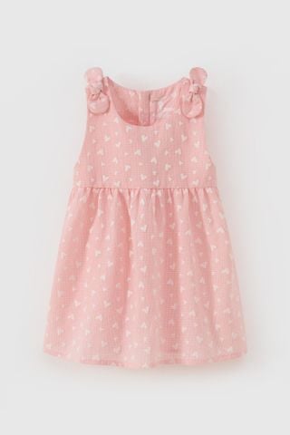 Đầm thô sát nách đính nơ vai in trái tim bé gái Rabity 952.006