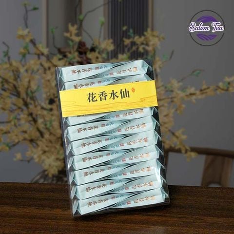 hộp nham trà lão tùng thủy tiên hộp 170g đặt nghiêng trên bàn