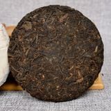 Trà phổ nhĩ chín chồi vàng Vân Nam năm 2014 bánh 100g