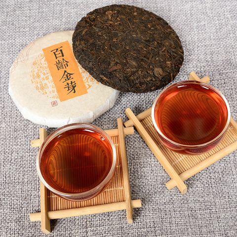 Trà phổ nhĩ chín chồi vàng Vân Nam năm 2014 bánh 100g