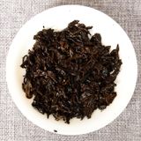 Trà phổ nhĩ chín chồi vàng Vân Nam năm 2014 bánh 100g