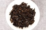 Trà phổ nhĩ chín chồi vàng Vân Nam năm 2014 bánh 100g