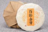 Trà phổ nhĩ chín chồi vàng Vân Nam năm 2014 bánh 100g