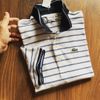 Polo Lacoste trắng kẻ xanh nhỏ