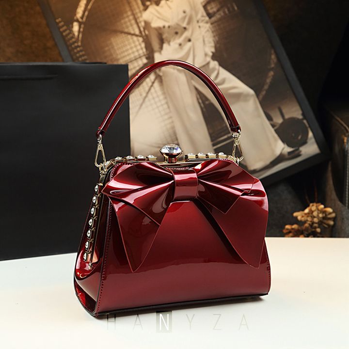 Túi nữ dáng vuông gắn nơ đính đá