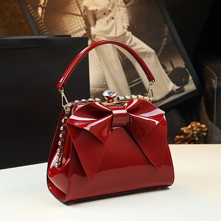 Túi nữ dáng vuông gắn nơ đính đá