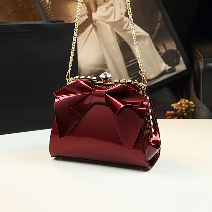 Túi nữ dáng vuông gắn nơ đính đá