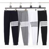  Quần jogger nam nữ form slim fit dáng Unisex Thom Browne 216 chất liệu nhung tăm mềm mại thiết kế kẻ sọc cực thời trang 