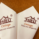 


																	 Khăn giấy ăn in logo Hiếu Cottage 