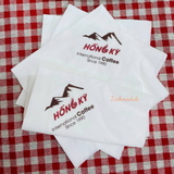 


																	 Khăn giấy ăn in logo nhà hàng CAFE Hồng Kỳ 