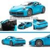 Mô hình xe Porsche 911 Carrera 4S (992) 1:24 Welly Miami Blue (3)