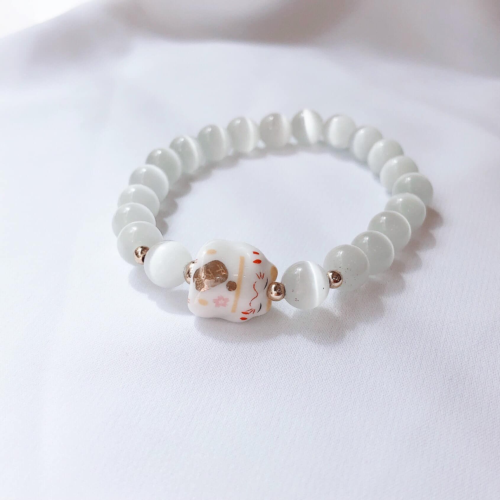  Vòng tay Neko vàng - Opal trắng 