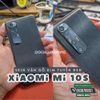 dan-skin-bao-ve-mat-lung-xiaomi-mi-10s-van-go-kim-tuyen-den