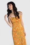 Đầm 2 dây ôm lụa in hoa nền vàng xẻ tà