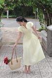 Đầm xòe cotton thêu vàng tay phồng dáng midi