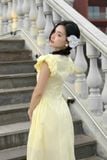 Đầm xòe cotton thêu vàng tay phồng dáng midi