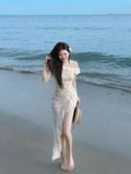 Đầm ôm ren hoa nổi lệch vai tà xéo dáng midi