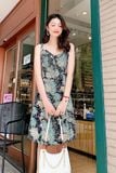 Đầm mini xòe lụa in họa tiết xanh vàng 2 dây cột nơ phối bèo