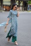 Áo dài ôm lụa in hoa nền xanh tay lửng phối bèo xòe
